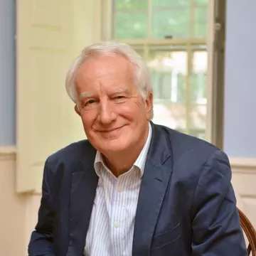 Professor David Charles seated and smiling